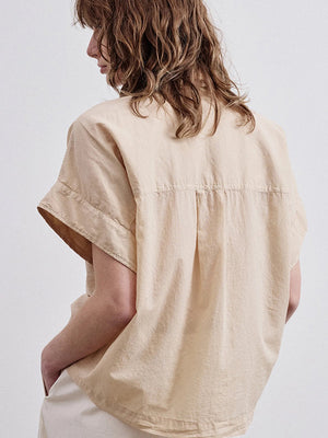 Sleeveless shirt in cotton muslin